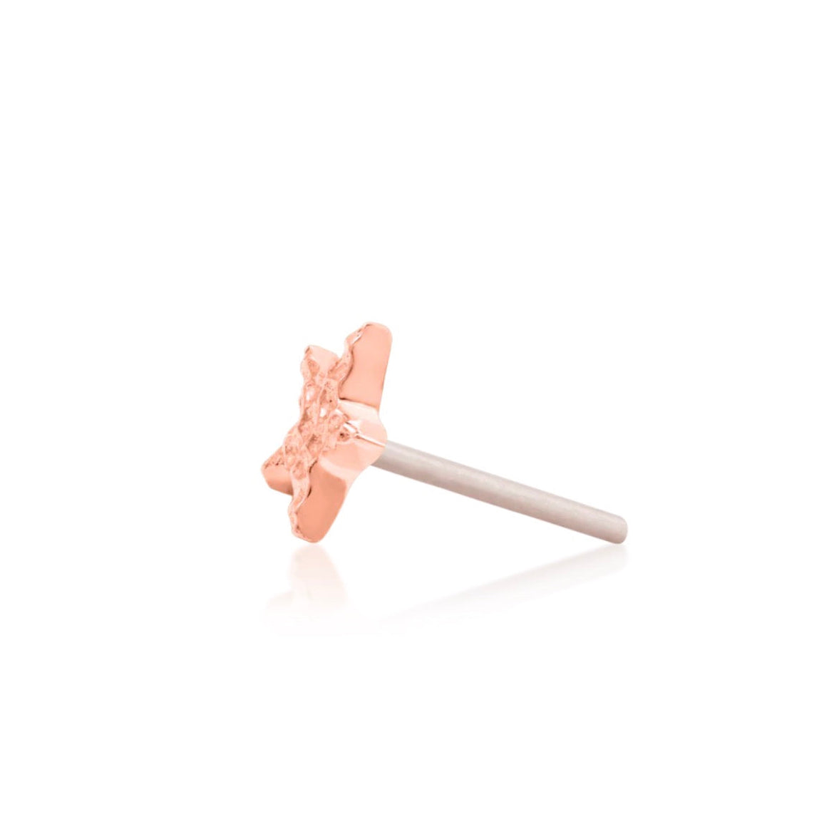 14k gold piercing jewellery in rose gold, featuring the compact Junipurr Hammered Star decorative end.