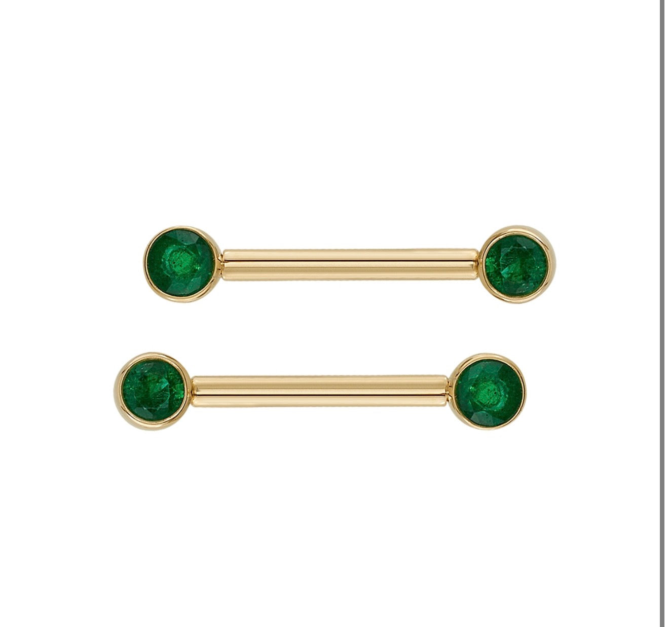 Angled view of BVLA 4MM Bezel Bell in yellow gold with bezel set Mercury Mist and Emerald gemstones