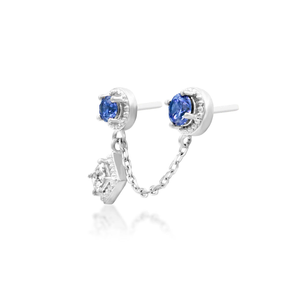 Angled view of Junipurr Finery light tanzanite and CZ threadless end in white gold for conch jewellery