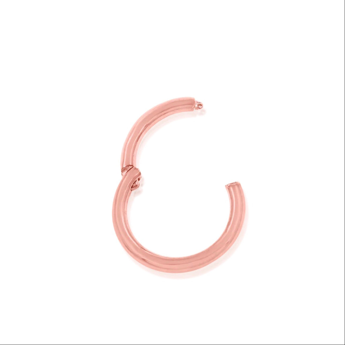 Gold conch hoop in 14k rose gold, featuring Junipurr’s polished plain hinged ring.