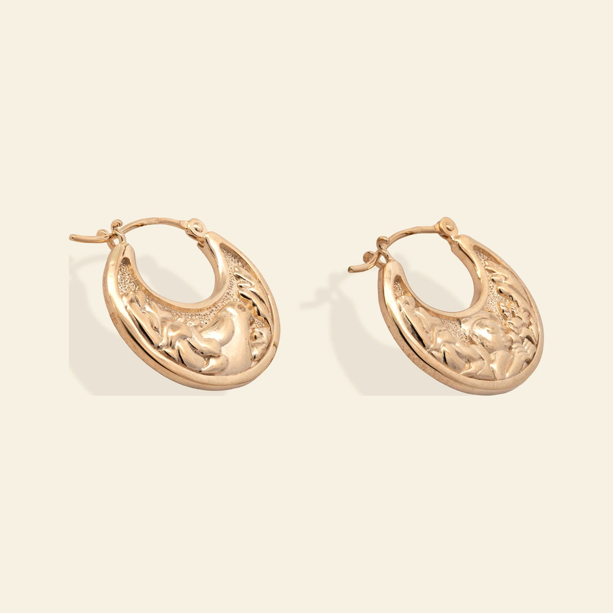 Junipurr x Frida Kahlo Muneca in 14k yellow gold vermeil, doll motif hoop earrings, front product view