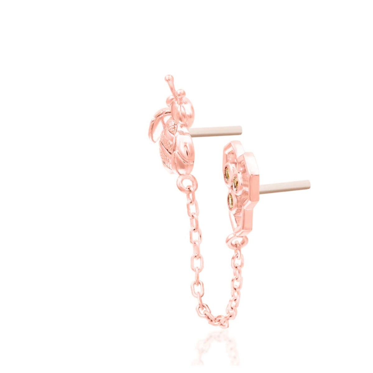 Junipurr Oh Honey solid 14k rose gold showing the sculpted motifs and articulated connecting chain.