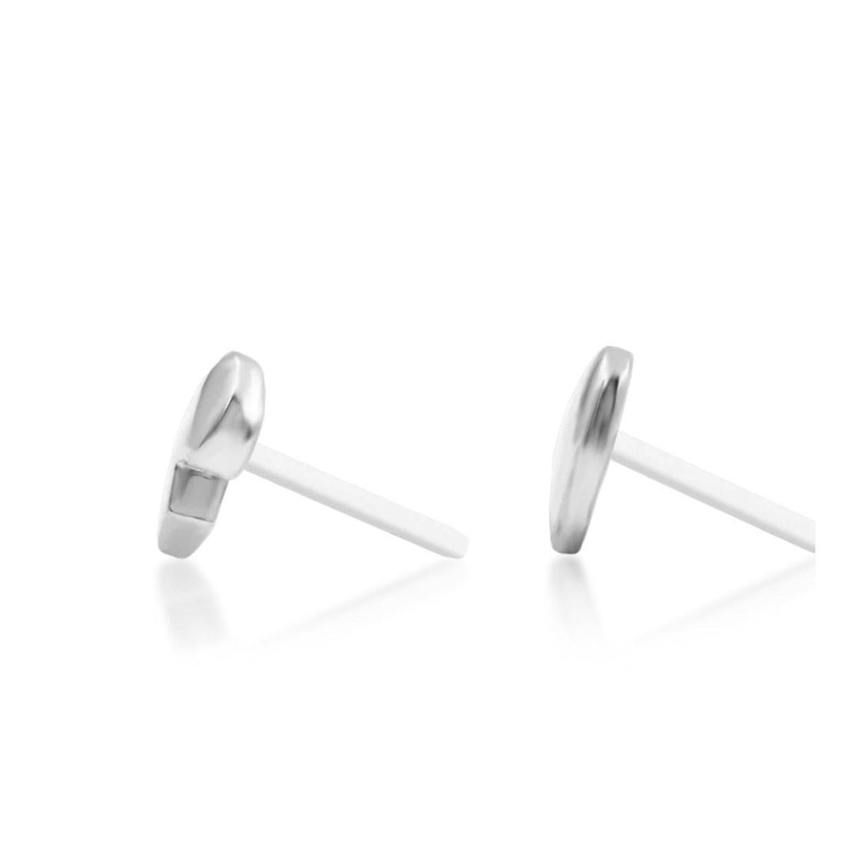 Matching heart threadless ends in polished white gold, each forming one half of a divided heart.