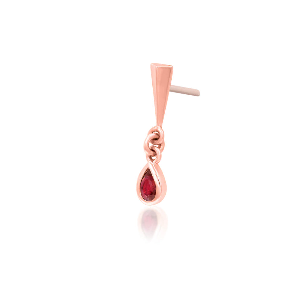 Rose gold cartilage jewellery with a miniature stake and articulated red gemstone dangle