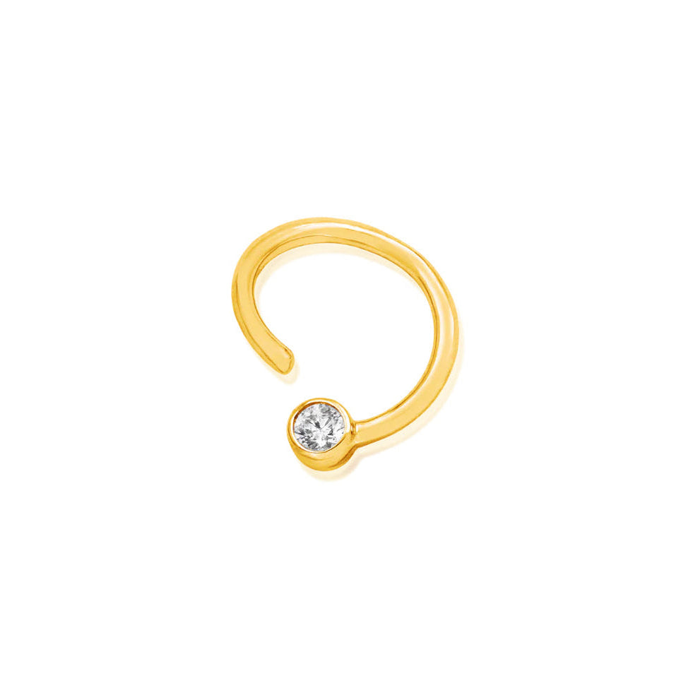 14k gold daith seam ring in yellow gold with a permanently fixed cubic zirconia bead.