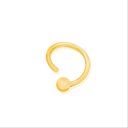 14k gold septum ring in yellow gold with a smooth fixed bead and seamless circular profile.