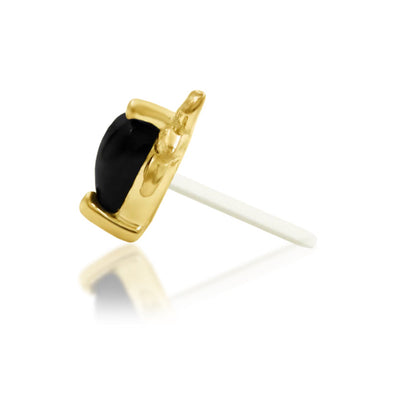 Side profile of the Junipurr Salem 14k gold threadless end showing its raised black onyx heart
