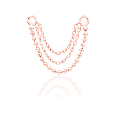 Junipurr Quinn triple piercing chain in solid 14k rose gold with layered graduated chain detail.