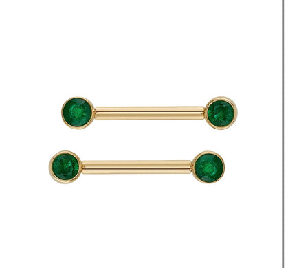 Angled view of BVLA 4MM Bezel Bell in yellow gold with bezel set Mercury Mist and Emerald gemstones