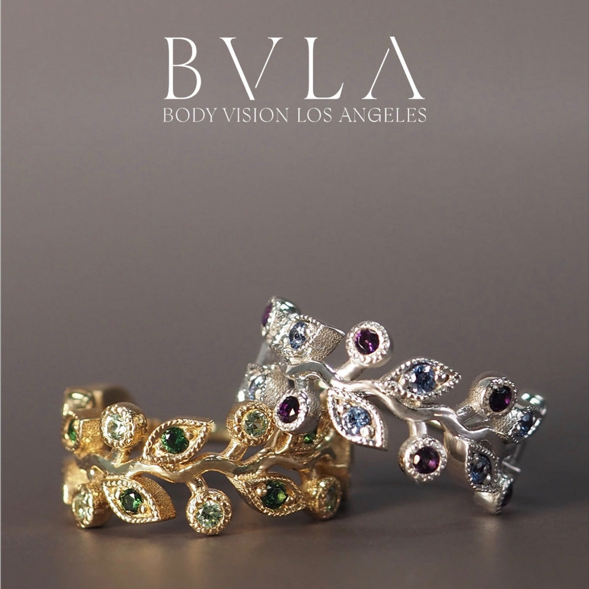 BVLA Arwen solid 14k gold huggie shown in two gemstone combinations: yellow gold with Green Tourmaline and Tsavorite, and white gold with Polar Sapphire and Amethyst for conch, helix and lobe piercings.