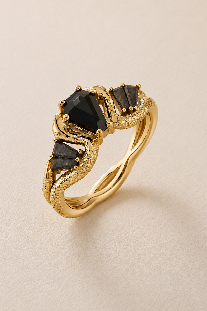 BVLA bespoke yellow gold snake engagement ring with a black diamond centre stone and sculpted serpent design, handcrafted as a luxury custom ring.
