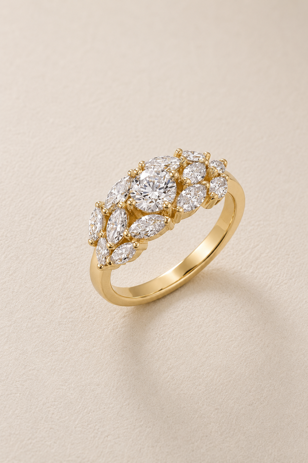 BVLA bespoke yellow gold engagement ring featuring a round brilliant diamond with marquise and pear diamond cluster shoulders in a handcrafted luxury custom design.
