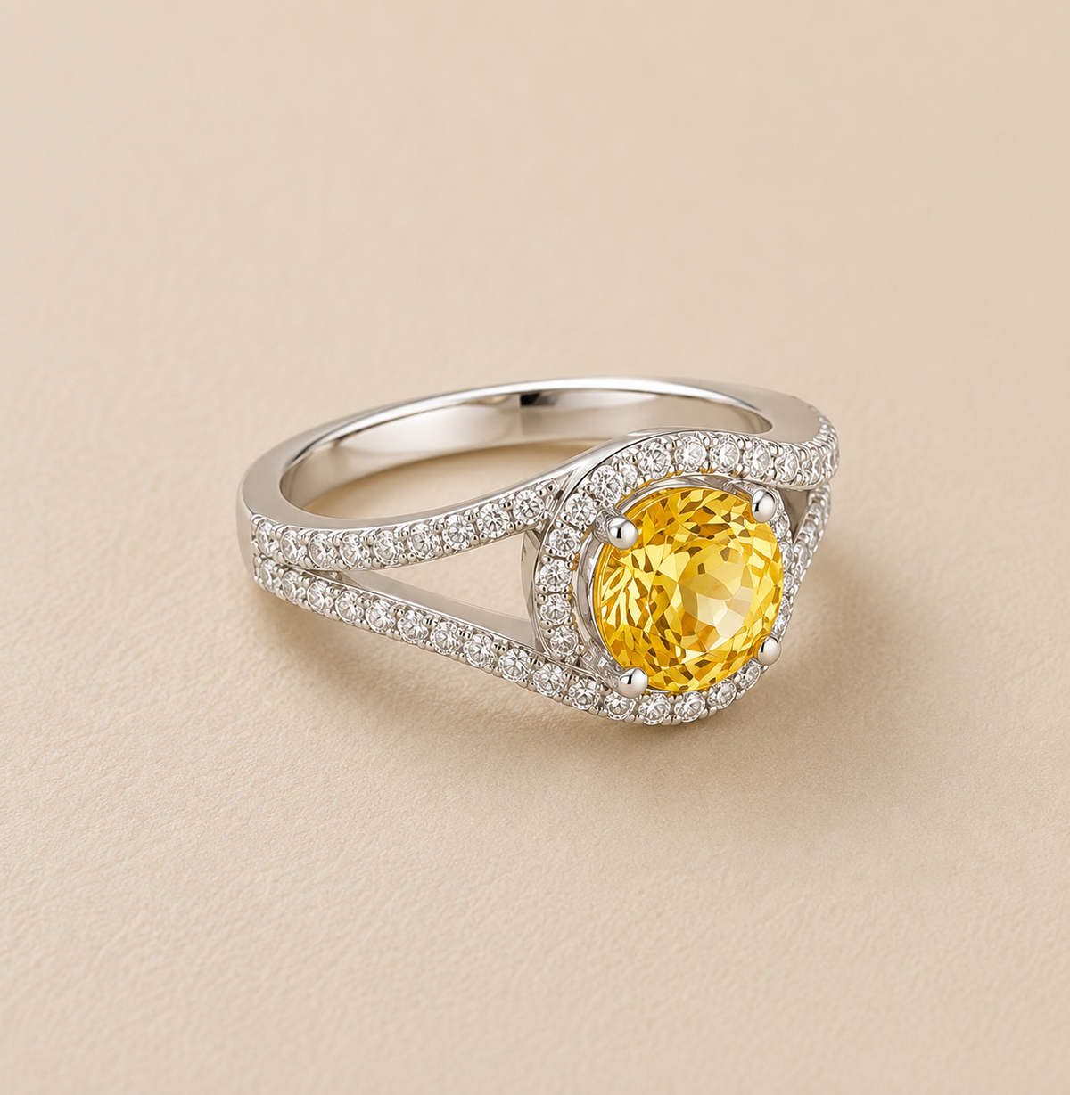 BVLA bespoke white gold engagement ring featuring a round yellow sapphire surrounded by a diamond halo with split pavé diamond shoulders, handcrafted as a luxury custom ring.