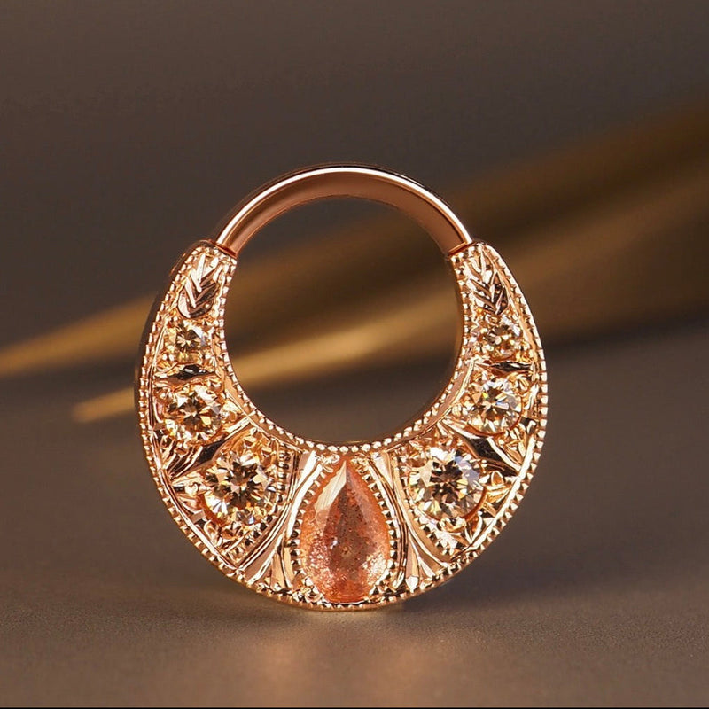 BVLA Boston rose gold septum ring featuring a pear-cut Oregon sunstone with champagne diamonds in an ornate handcrafted luxury body jewellery design.