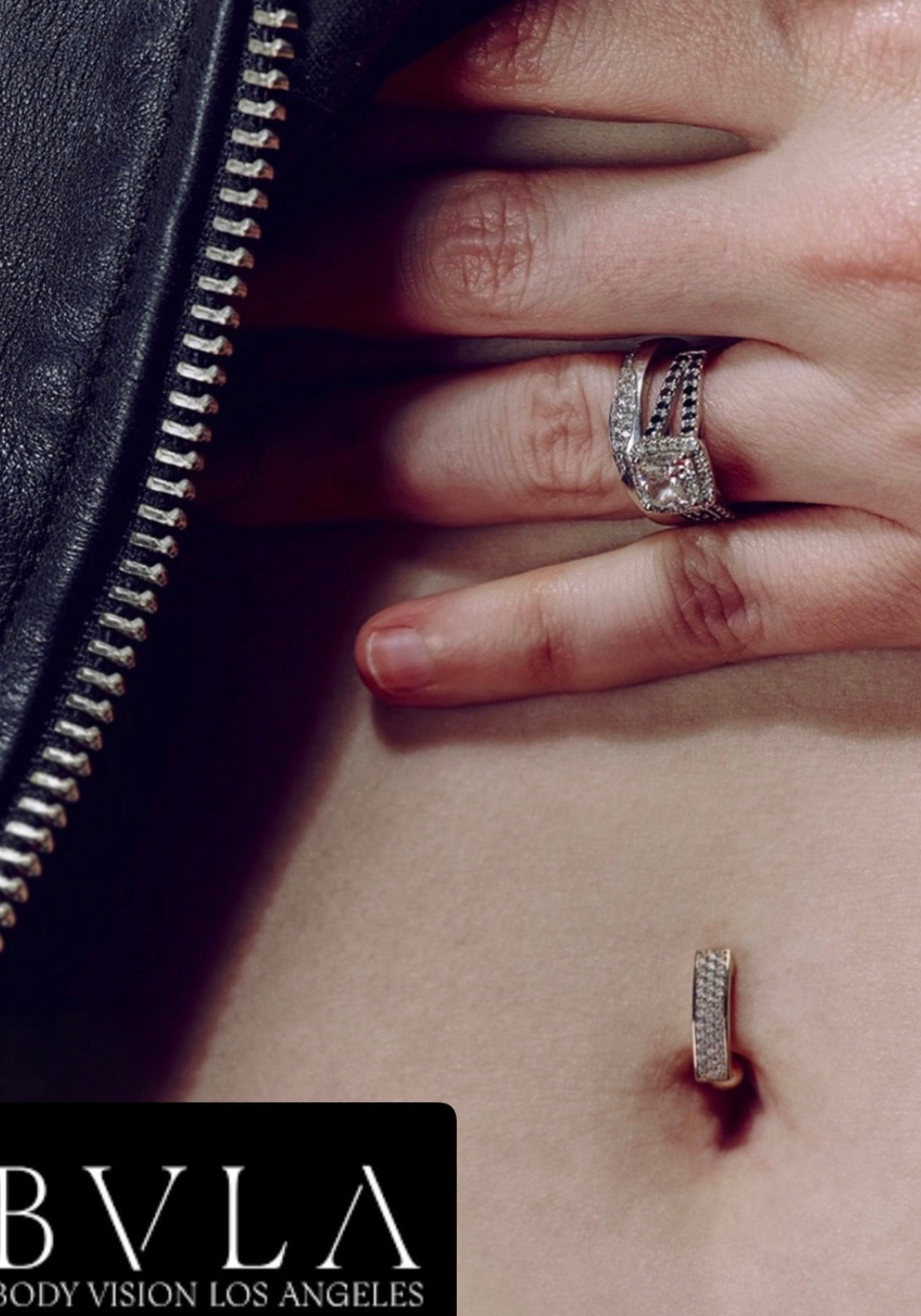 Model wearing a BVLA diamond engagement ring with a diamond pavé navel ring, showcasing luxury fine jewellery styling in white gold.