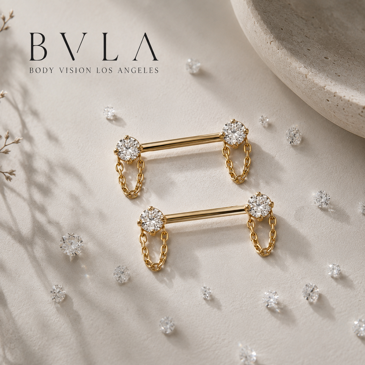 BVLA 14k gold diamond nipple bars featuring bezel-set diamonds with delicate dangle chains, luxury nipple piercing jewellery.