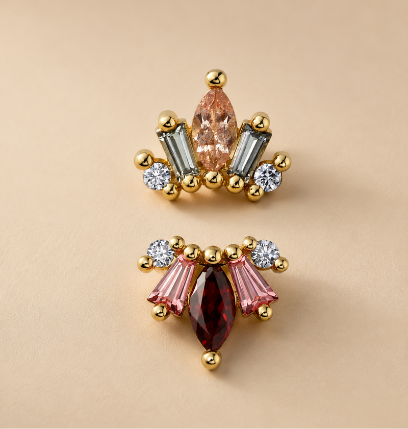 BVLA La Princesa solid 14k yellow gold threadless end shown in two gemstone combinations: white diamond, Chatham padparadscha sapphire and garnet, and white diamond, grey sapphire and Oregon sunstone, suitable for helix, flat, conch and lobe piercings.