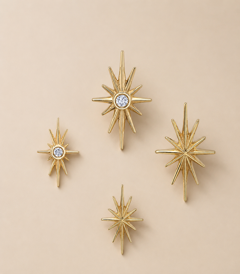 BVLA solid 14k yellow gold North Star threadless ends shown in multiple sizes with plain polished starburst designs and bezel-set diamond starburst ends, suitable for helix, flat, tragus and lobe piercings.

