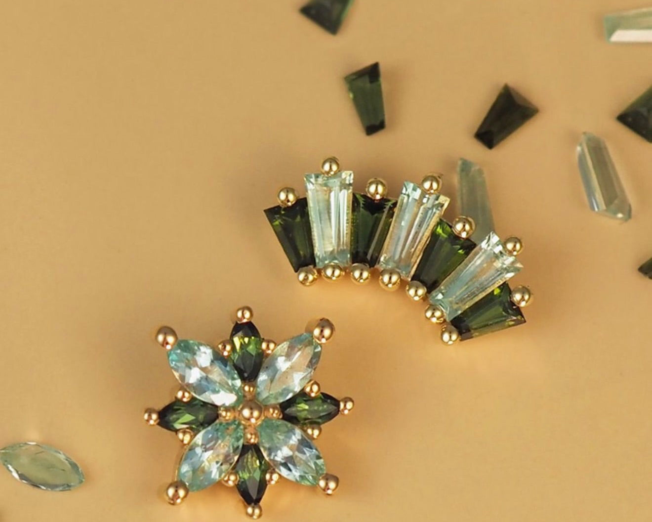 BVLA Polaris and Oceane 7 in 14k gold featuring lab-grown chrysoberyl and green tourmaline gemstones, luxury piercing jewellery for curated ear styling.
