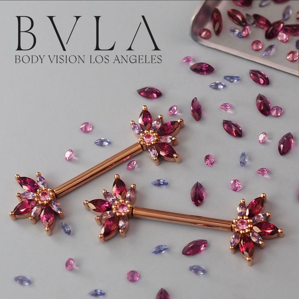 BVLA Starling yellow gold industrial barbell featuring rhodolite garnets, pink sapphires and tanzanites in a handcrafted luxury 14k gold body jewellery design.