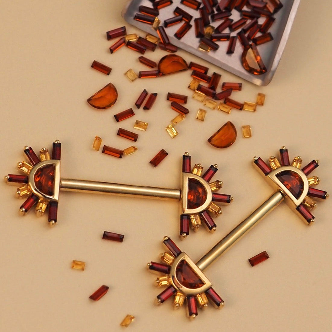 BVLA Sunset Narwhal solid 14k yellow gold industrial barbell featuring matching sunburst ends set with Madeira citrine, citrine and garnet gemstones, designed for luxury industrial ear piercings.