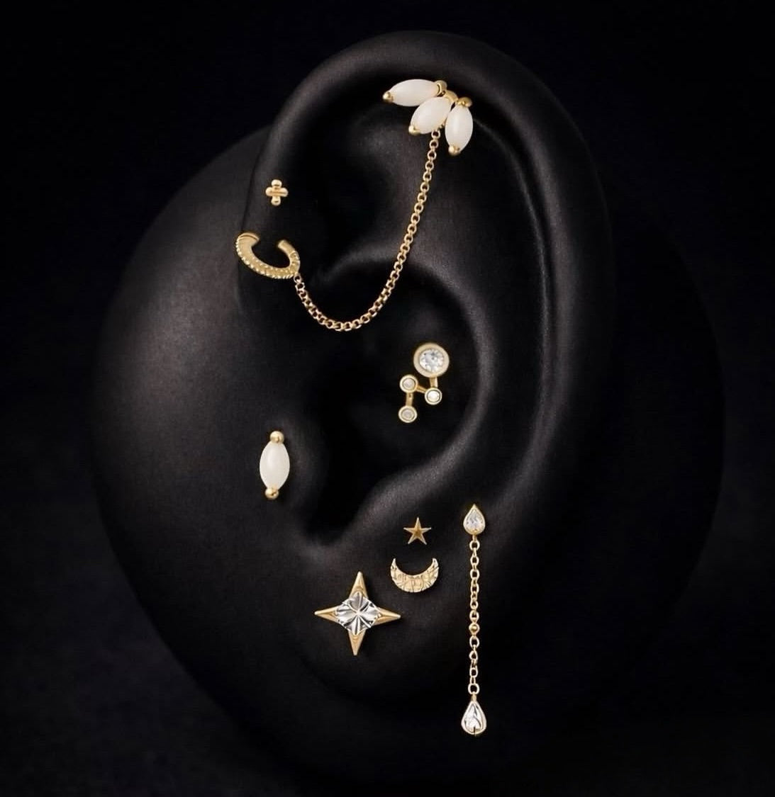 Discover a celestial curated ear featuring star and moon gold piercing jewellery. Shop the pieces used in this styling and recreate the look.
