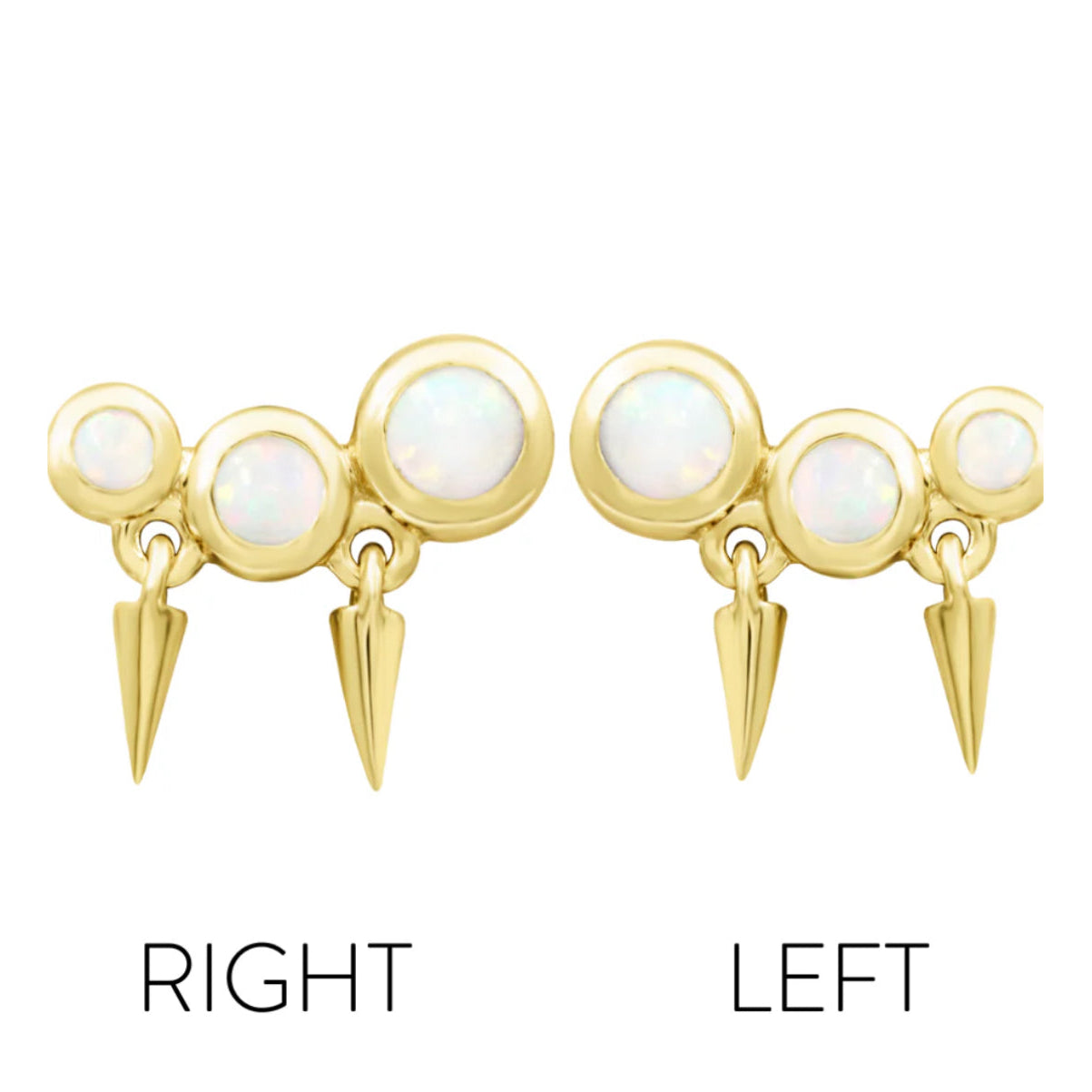 Close-up of graduating white opals and polished gold spike detailing in yellow gold.