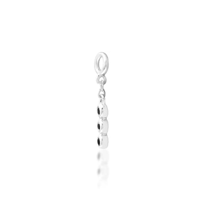 Angled view of Junipurr Cohen black CZ charm in white gold for conch jewellery

