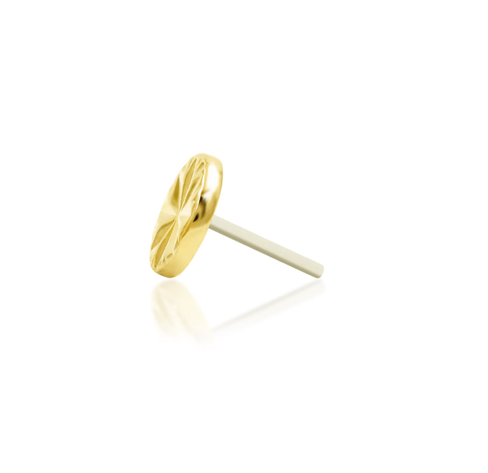 Side profile of the Junipurr Engraved Disk yellow gold cartilage earring top, showing the slim disc and threadless pin.
