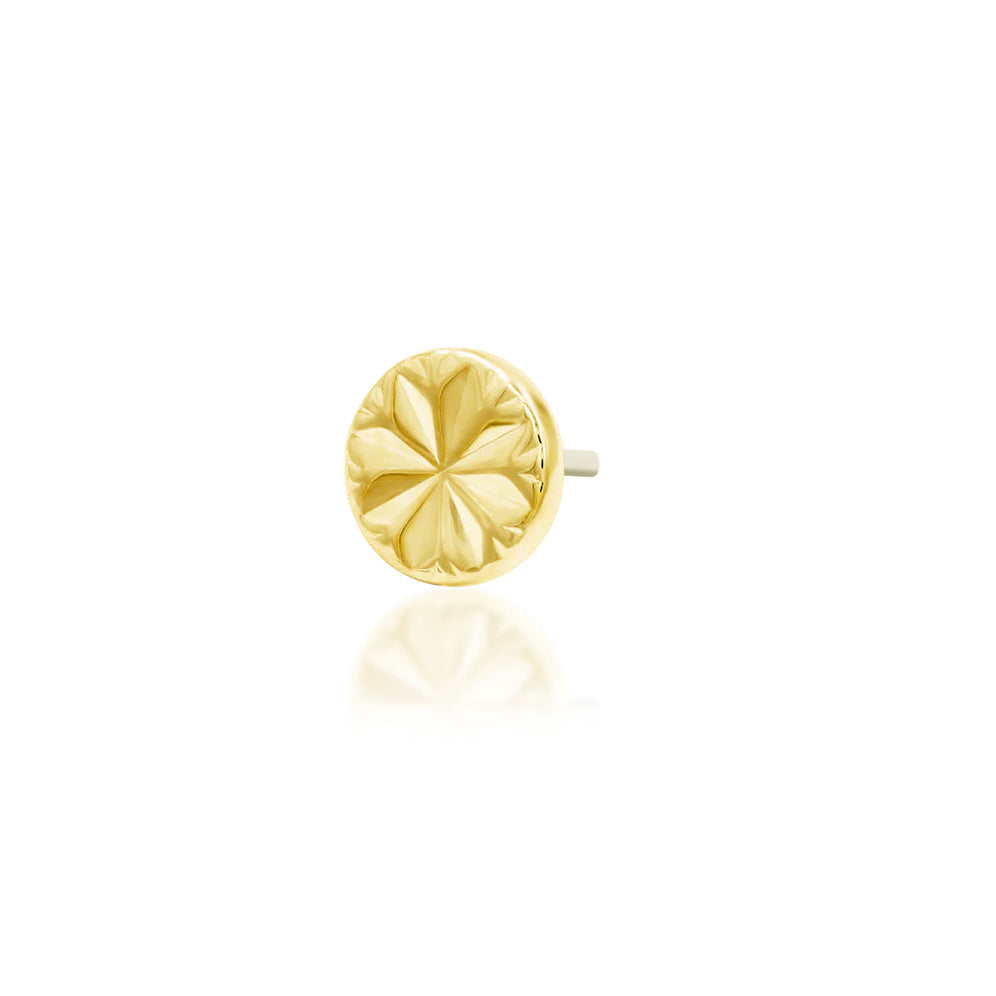 Angled view of the Junipurr Engraved Disk yellow gold helix stud, showing its polished round surface and engraved star.