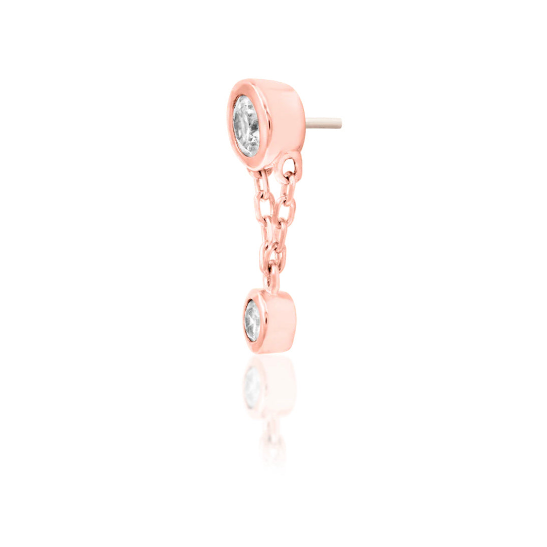 Angled perspective of Junipurr Jewellery Cora rose gold threadless decorative end designed for curated ear styling