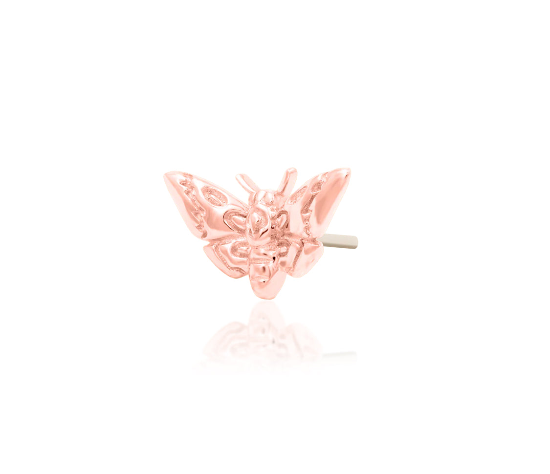 Angled view of Junipurr Jewellery Death Head Moth rose gold threadless decorative end
