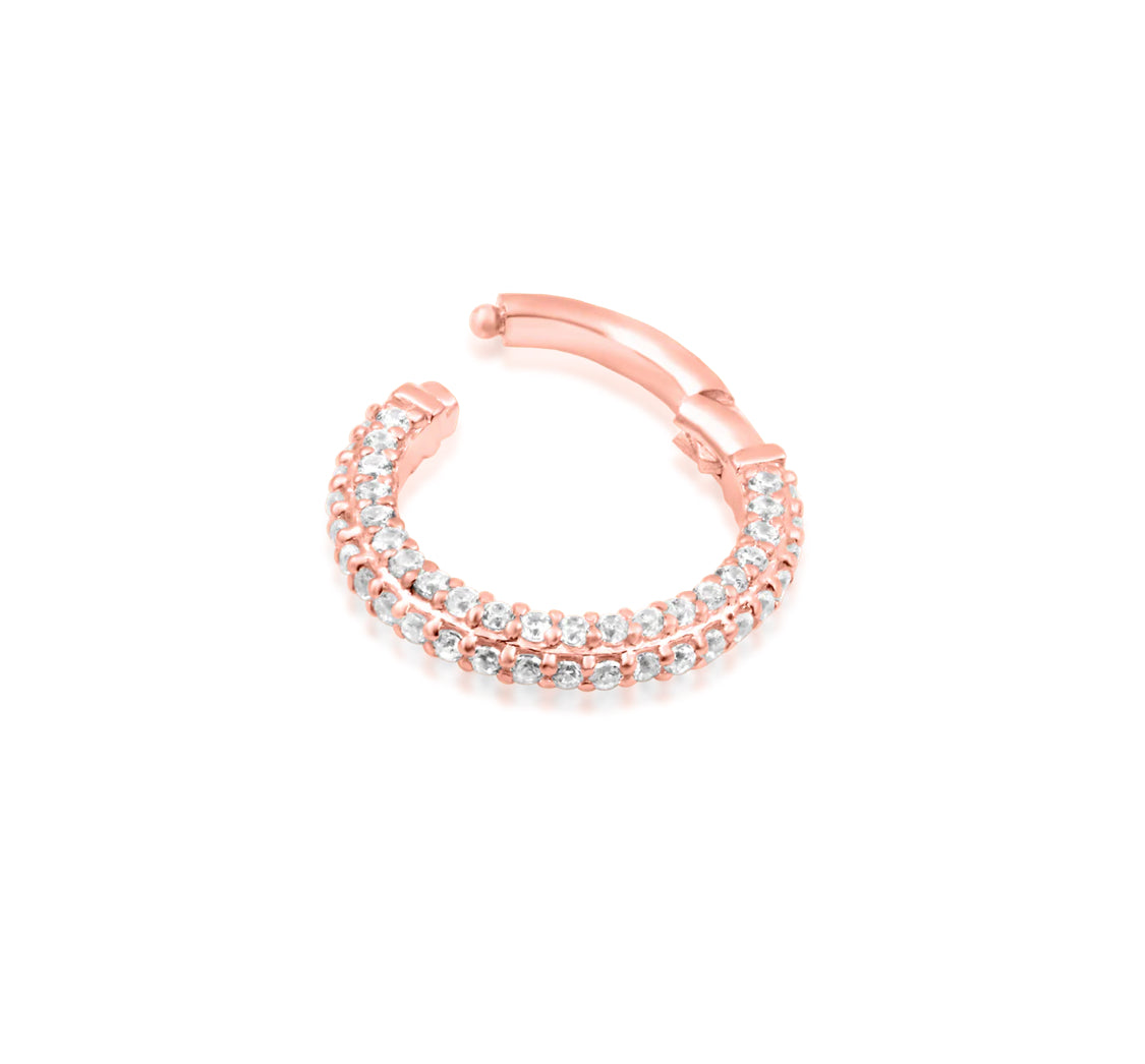 Angled view of Junipurr Jewellery Demi rose gold hinged clicker ring with white CZ gemstones
