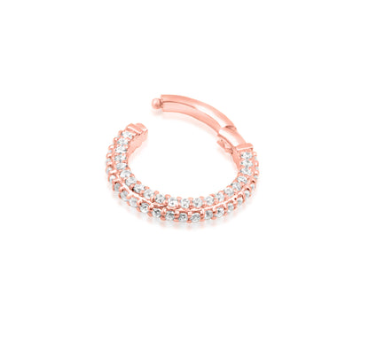 Angled view of Junipurr Jewellery Demi rose gold hinged clicker ring with white CZ gemstones
