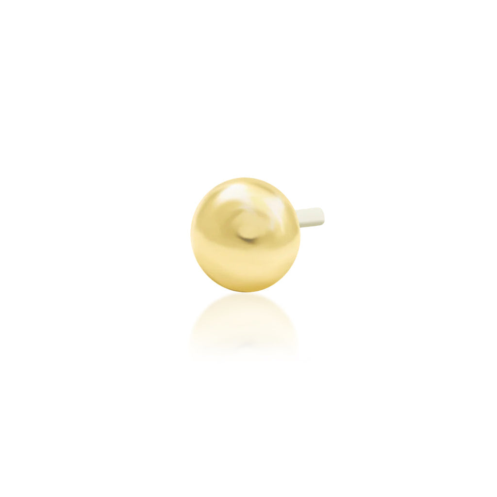 Angled view of Junipurr Jewellery Dome polished dome threadless decorative end in 14k yellow gold