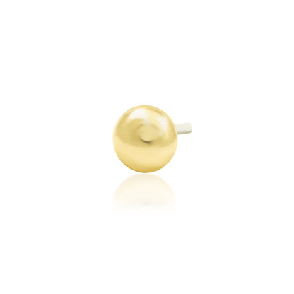 Angled view of Junipurr Jewellery Dome polished dome threadless decorative end in 14k yellow gold
