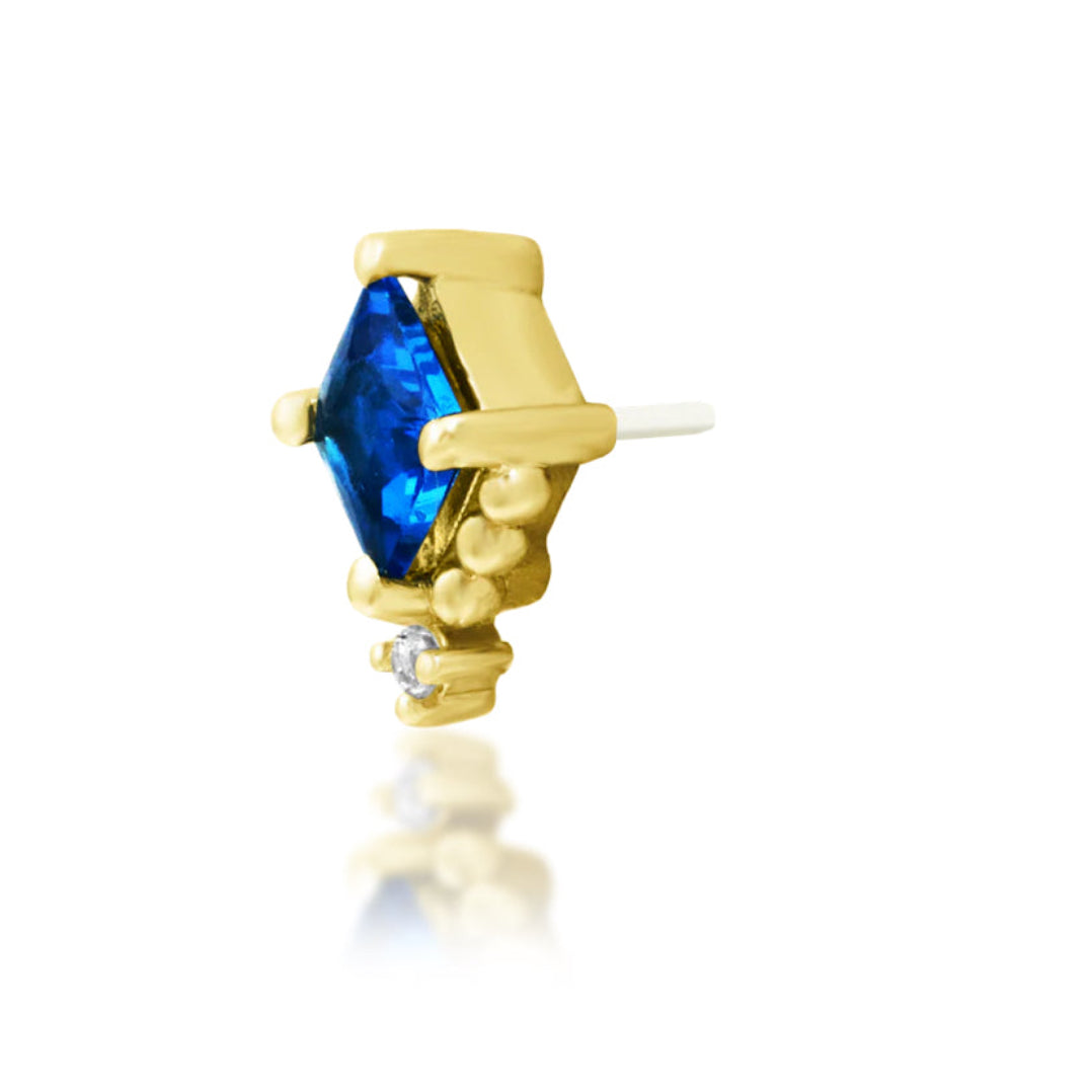 Angled view of Junipurr Jewellery Hesper highlighting sapphire blue gemstone and white CZ accents
