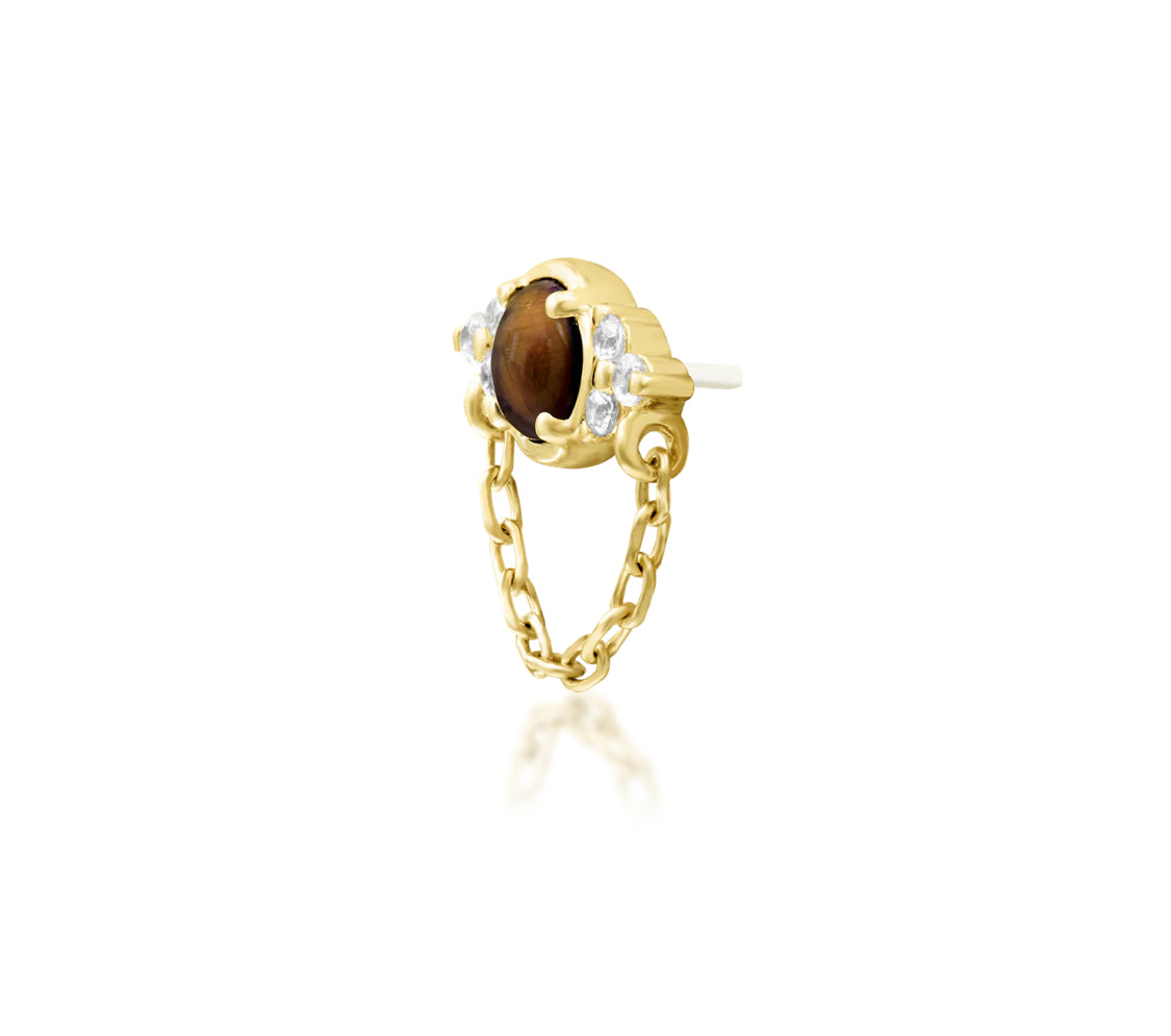 Angled view of Junipurr Jewellery Hobbs tiger eye and cubic zirconia threadless decorative end in yellow gold
