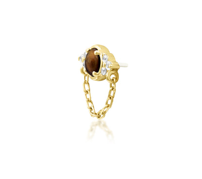 Angled view of Junipurr Jewellery Hobbs tiger eye and cubic zirconia threadless decorative end in yellow gold