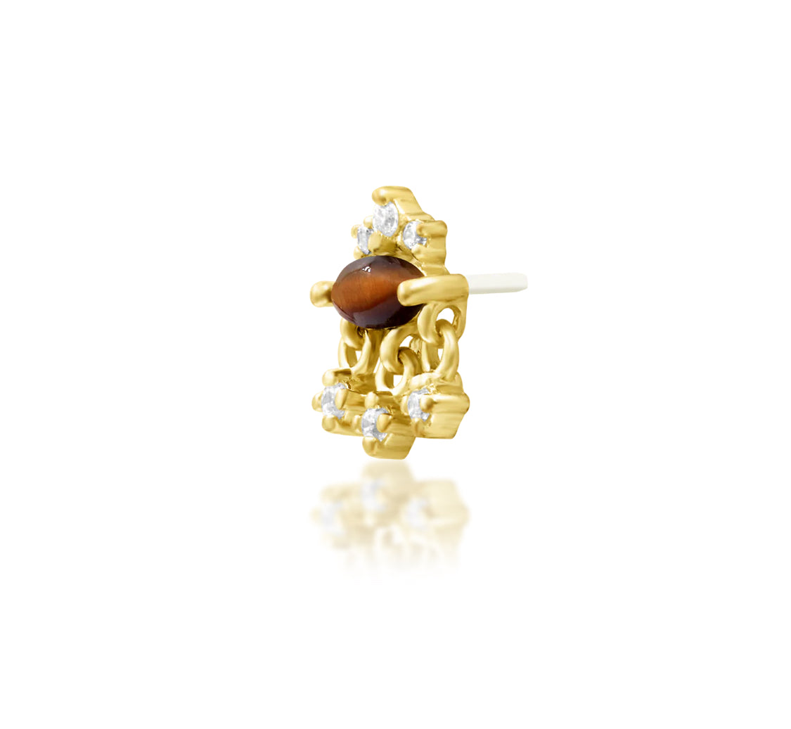 Angled view of Junipurr Jewellery Munna tiger eye and cubic zirconia threadless decorative end in yellow gold