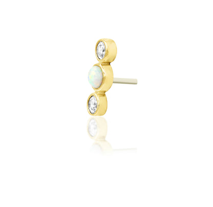 Off front angled view of the Junipurr Jewellery Nani in yellow gold highlighting triple bezel CZ and opal detailing.