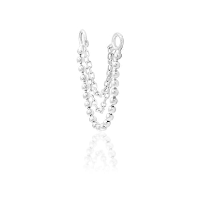Off front angled view of the Junipurr Jewellery Quinn charm in white gold showing clean layered chain design.