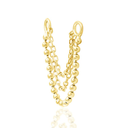 Off front angled view of the Junipurr Jewellery Quinn charm in yellow gold highlighting layered chain movement.