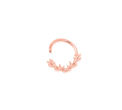 Off-front angled view of the Junipurr Jewellery Raven ring in rose gold, showcasing its warm polished tone