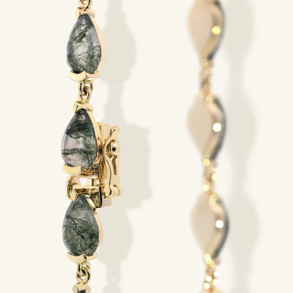 Angled view of Junipurr Jewellery Vardis moss agate bracelet in gold vermeil