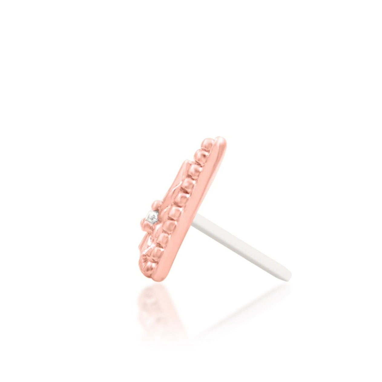 Side profile of a rose gold threadless decorative end.