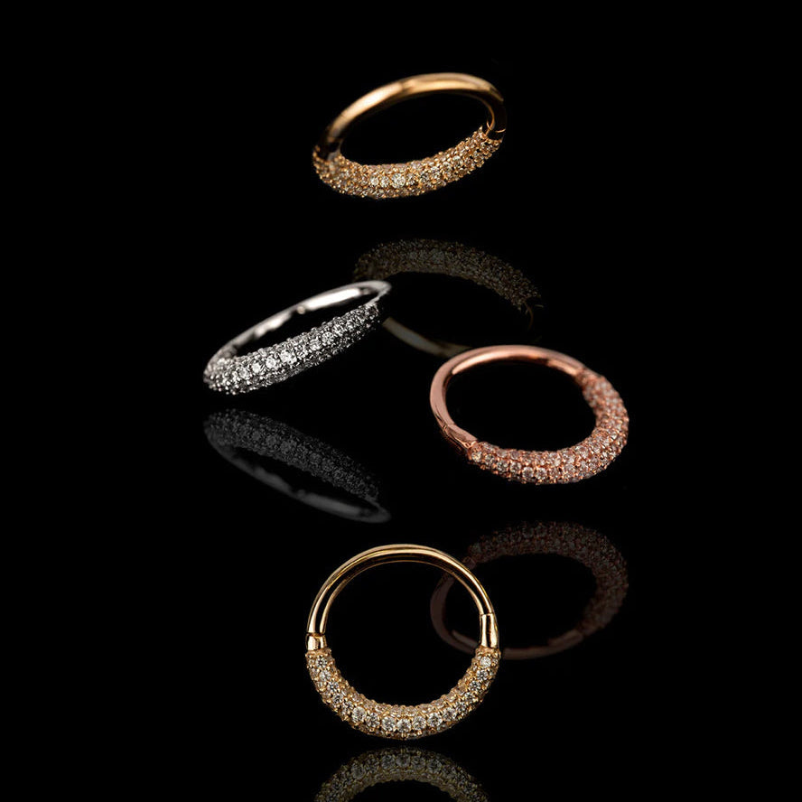 Styled photograph featuring the Junipurr Opulence 14k gold pavé clicker