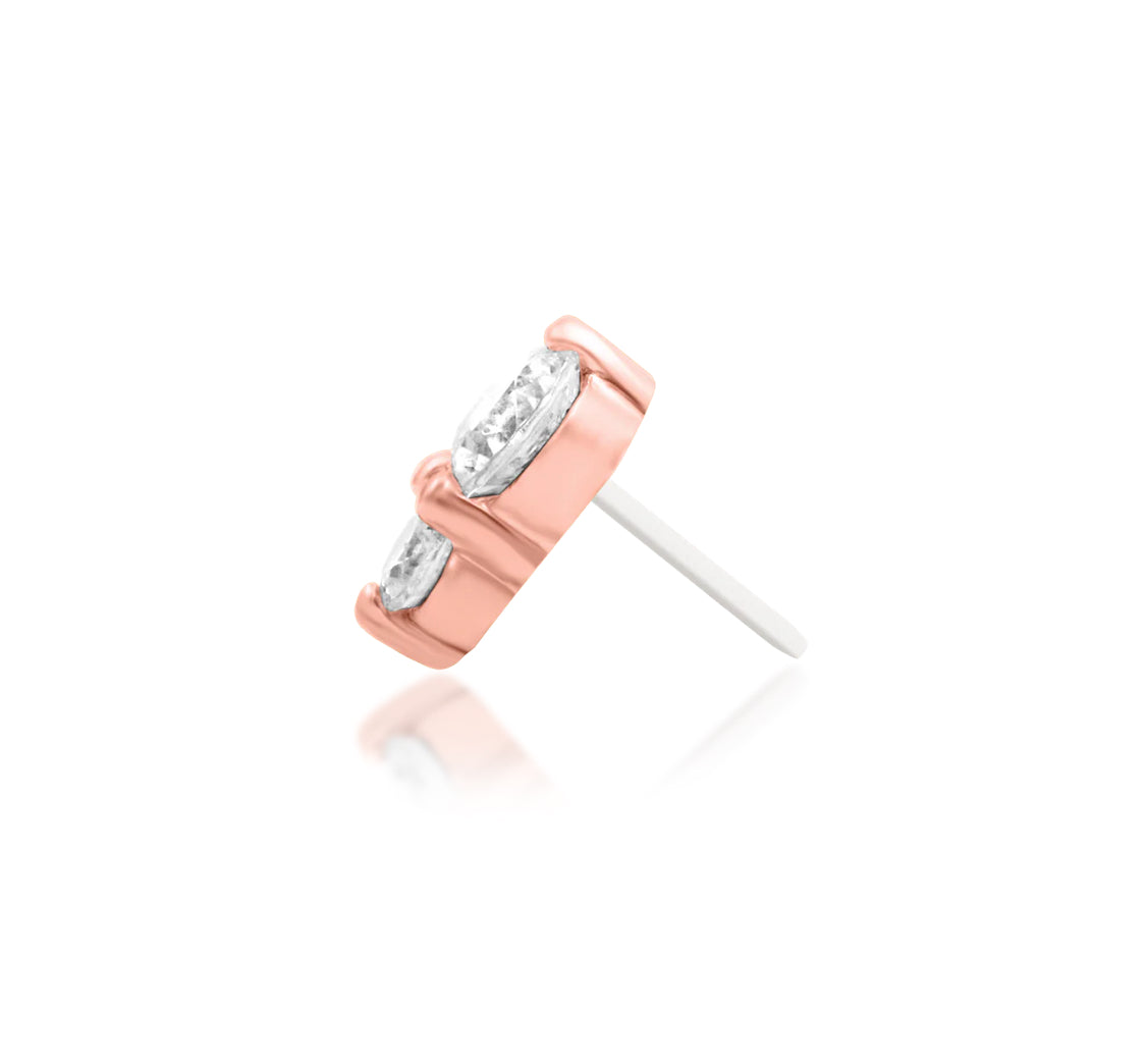 Solid 14k rose gold ear piercing jewellery with two brilliant cubic zirconia stones.