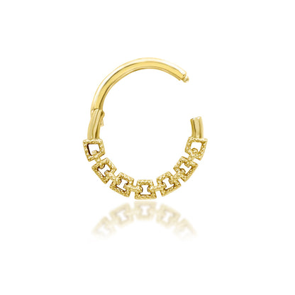 Gold daith ring in 14k yellow gold with Junipurr Sasha’s repeating open-link pattern.
