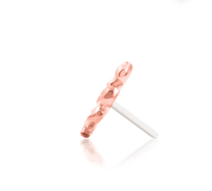 Smooth rose gold snake-shaped earring worn as a small statement in a lobe piercing.
